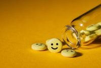 close-shot-pills-smiley-faces-glass-bottle-yellow